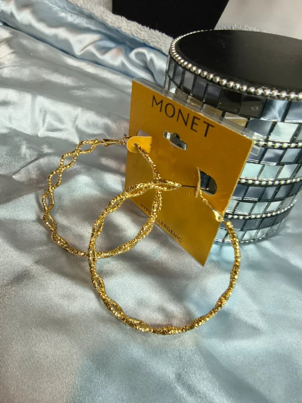 Monet Gold Tone Criss Cross Hoop earrings